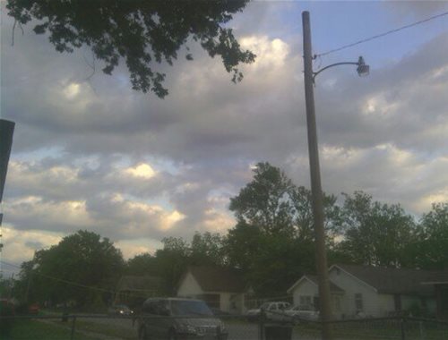 This is a picture of the clouds in my neighborhood and my neighbors houses.I hope you like it.I took the picture myself.
