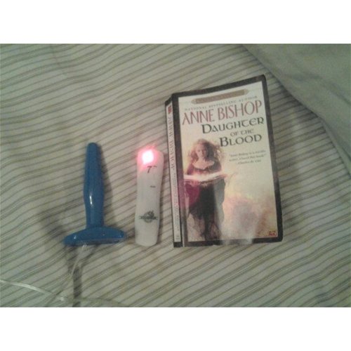 Plug and remote next to mass media paperback