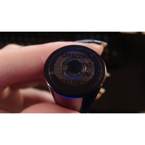 'unscrew cap and remove insulator'