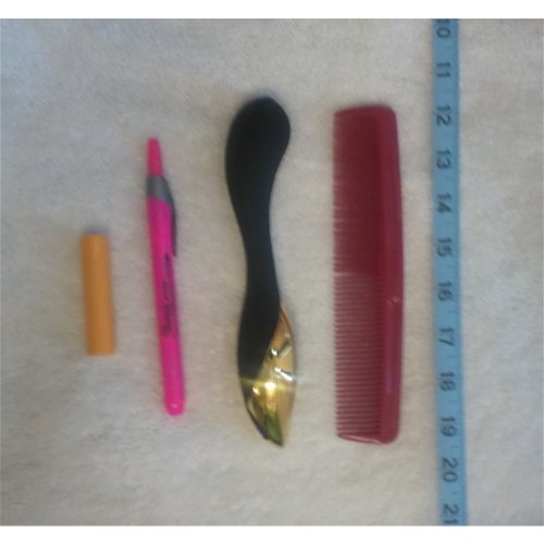 Size comparison to lip balm, a highlighter, and a comb
