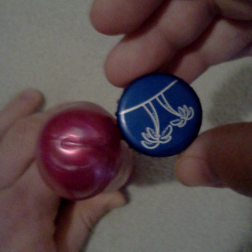 Head of Dick Head comaired to a bottle cap