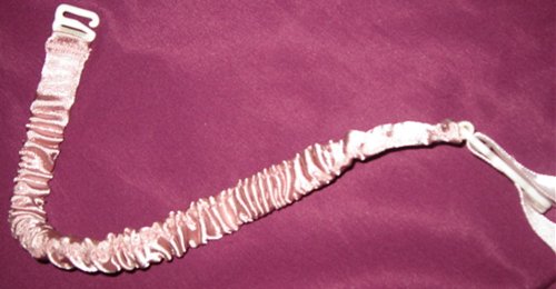 Removable garter. Non-adjustable. Plastic clips.