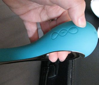 Showing how its held during use. Buttons face you but are awkward to get to with your thumb