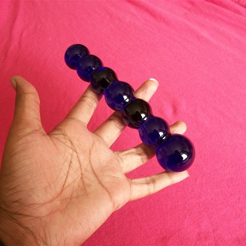 glass toy in hand