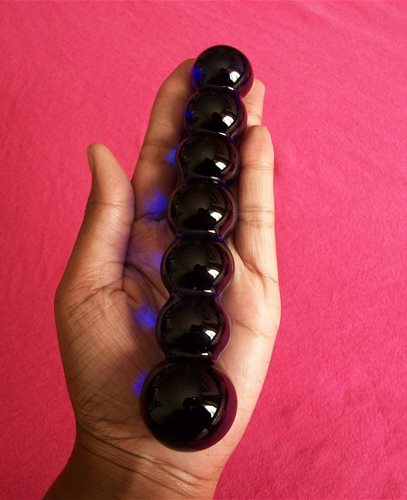 glass toy in palm