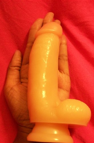 Dildo in palm