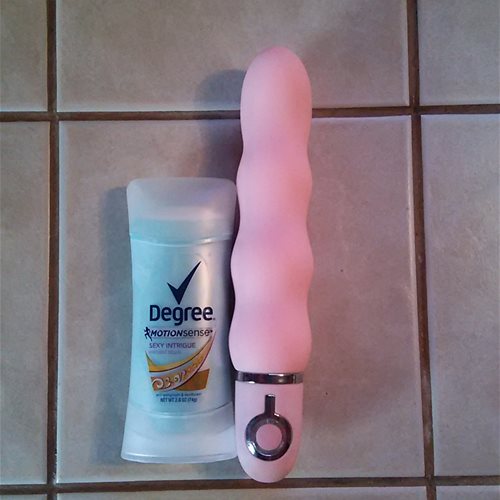 Elysium next to a 2.6oz deodorant stick