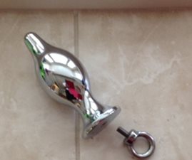 Ring un-threads out/ End of Pacifier base flares out. That stops toy from entering your rectum