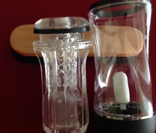 chamber on the bottom of left picture will engulf the white vibrator in the right side picture